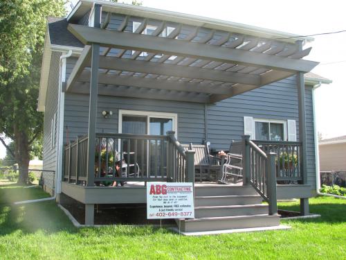 Composite deck with railings and pergola in Norfolk, NE